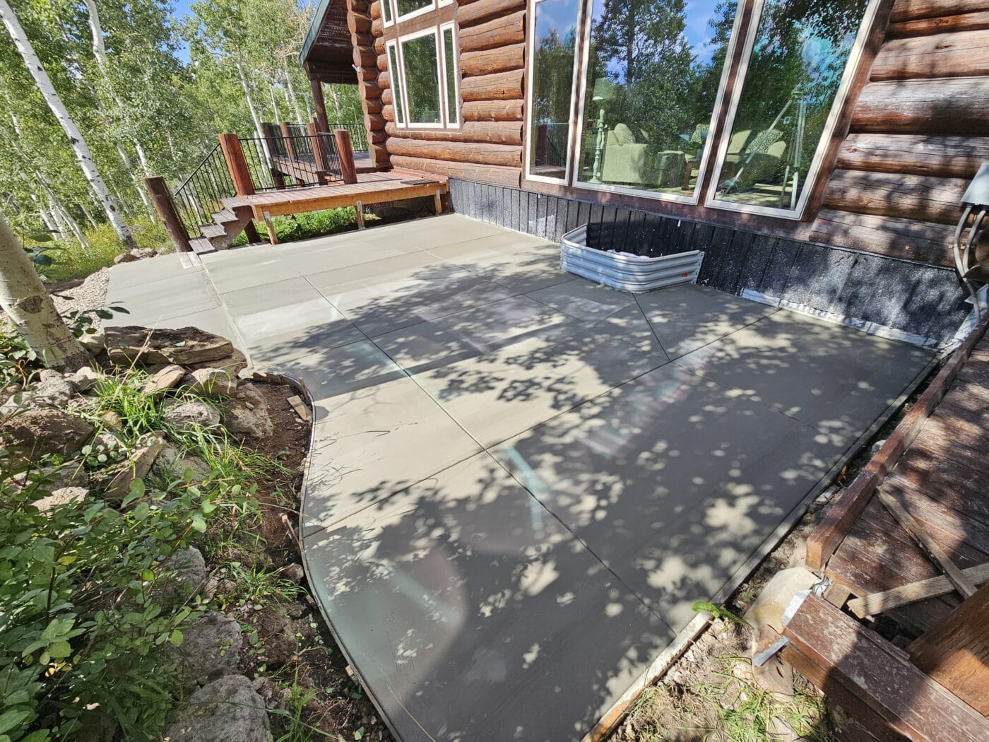 Concrete Flatwork patio on log home