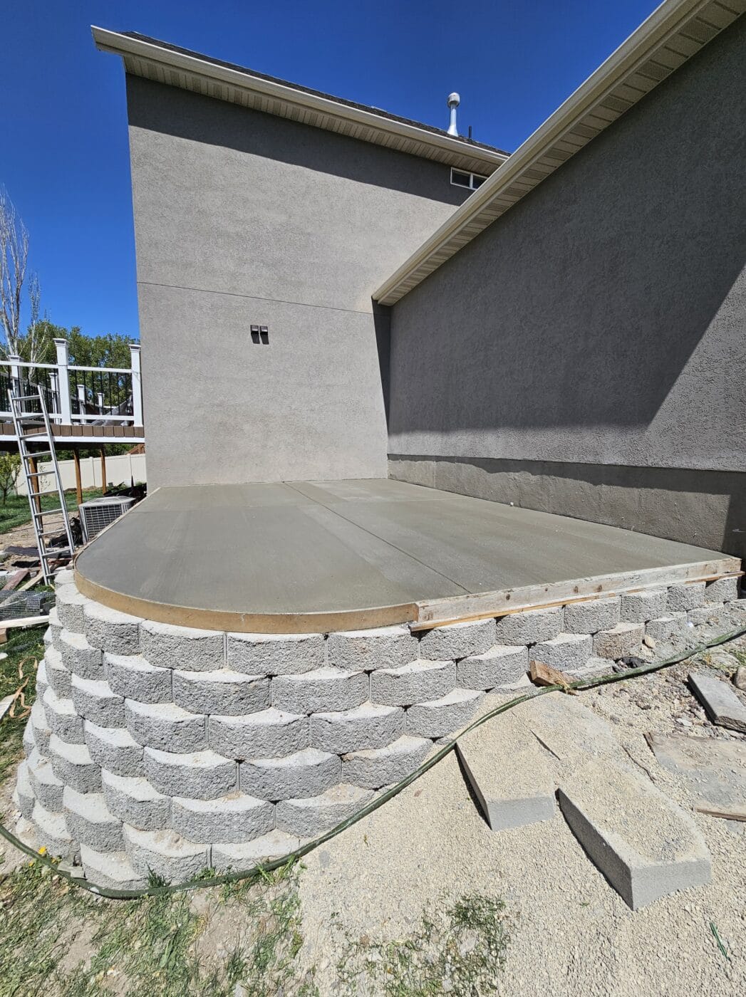 Concrete Pad on top of retaining wall